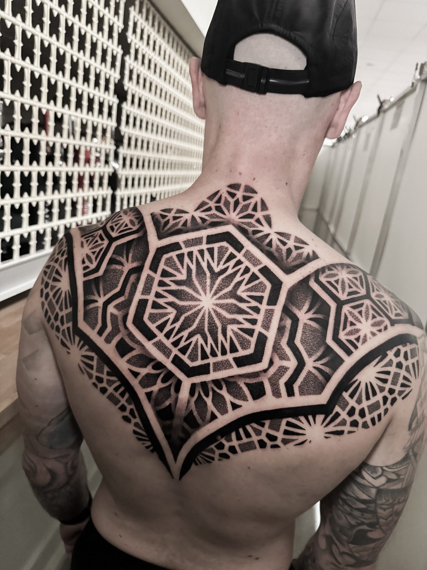 Large geometric back piece tattoo by Liam Couper, Fife