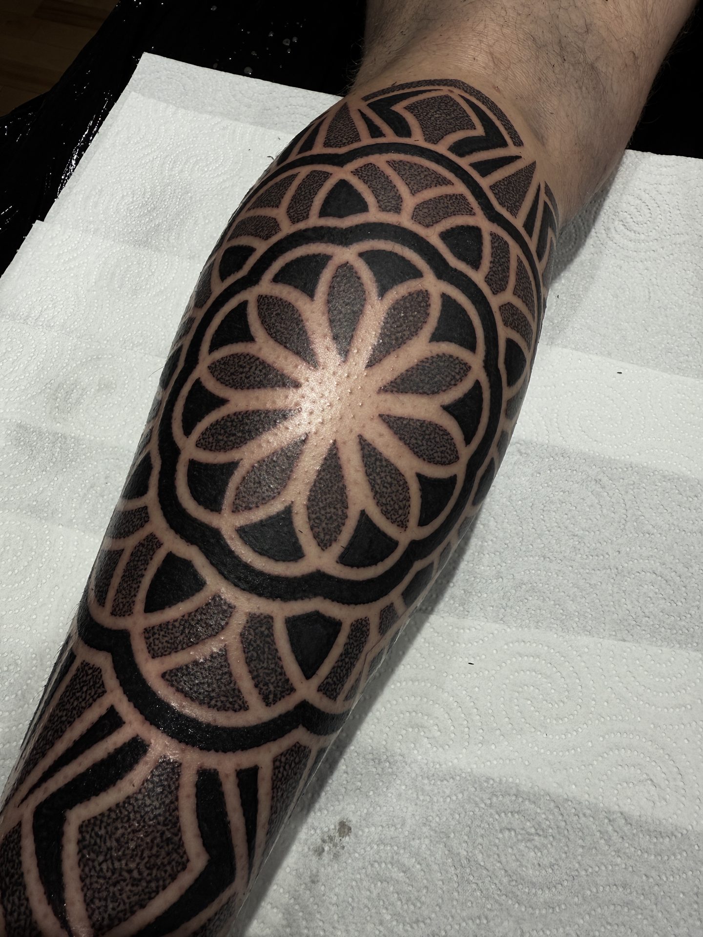 Geometric mandala knee tattoo by Liam Couper, Fife