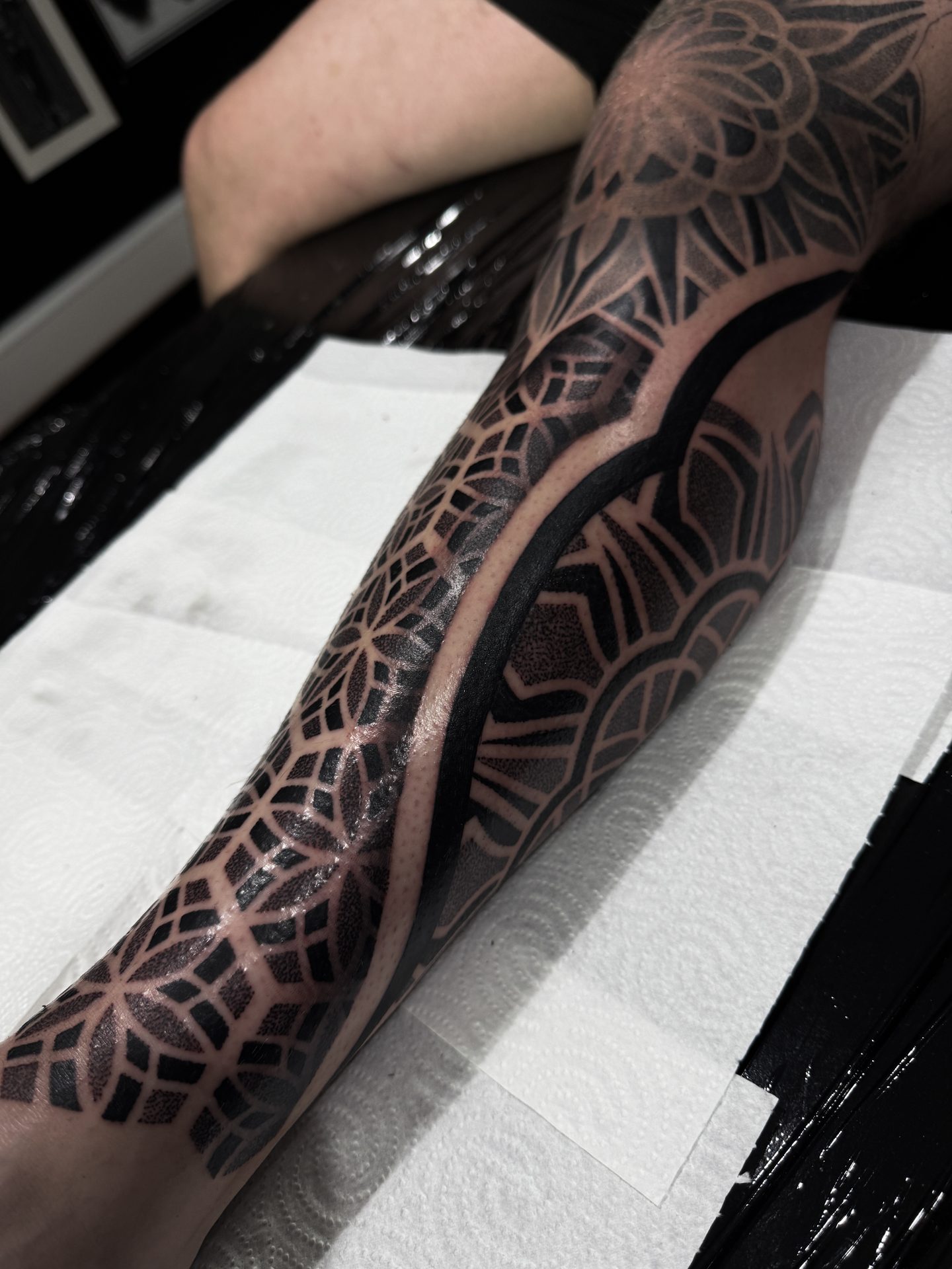 Banded geometric leg sleeve tattoo by Liam Couper, Fife
