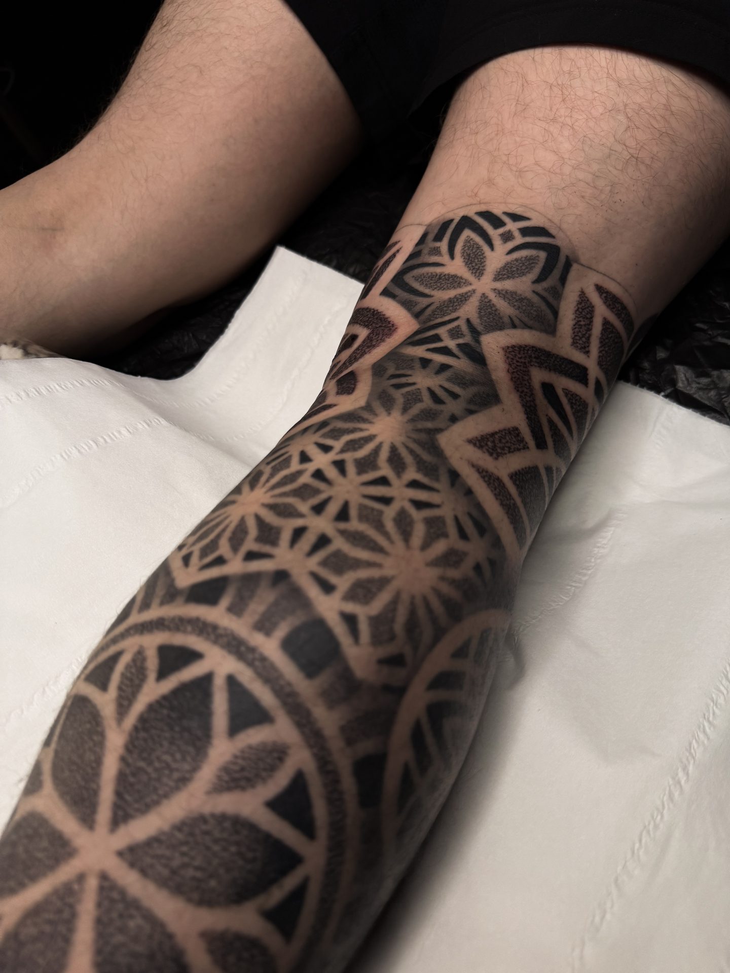 Full geometric leg sleeve tattoo by Liam Couper