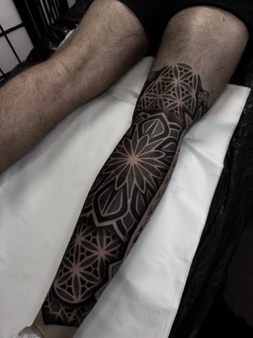 Geometric dotwork leg sleeve from behind by Liam Couper