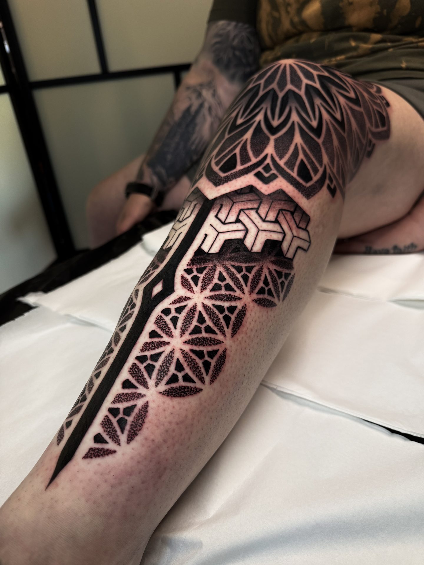 Geometric leg sleeve tattoo, healed, by Liam Couper