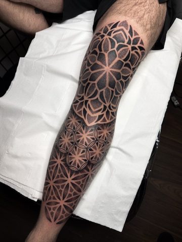 Geometric mandala leg sleeve tattoo by Liam Couper, Fife