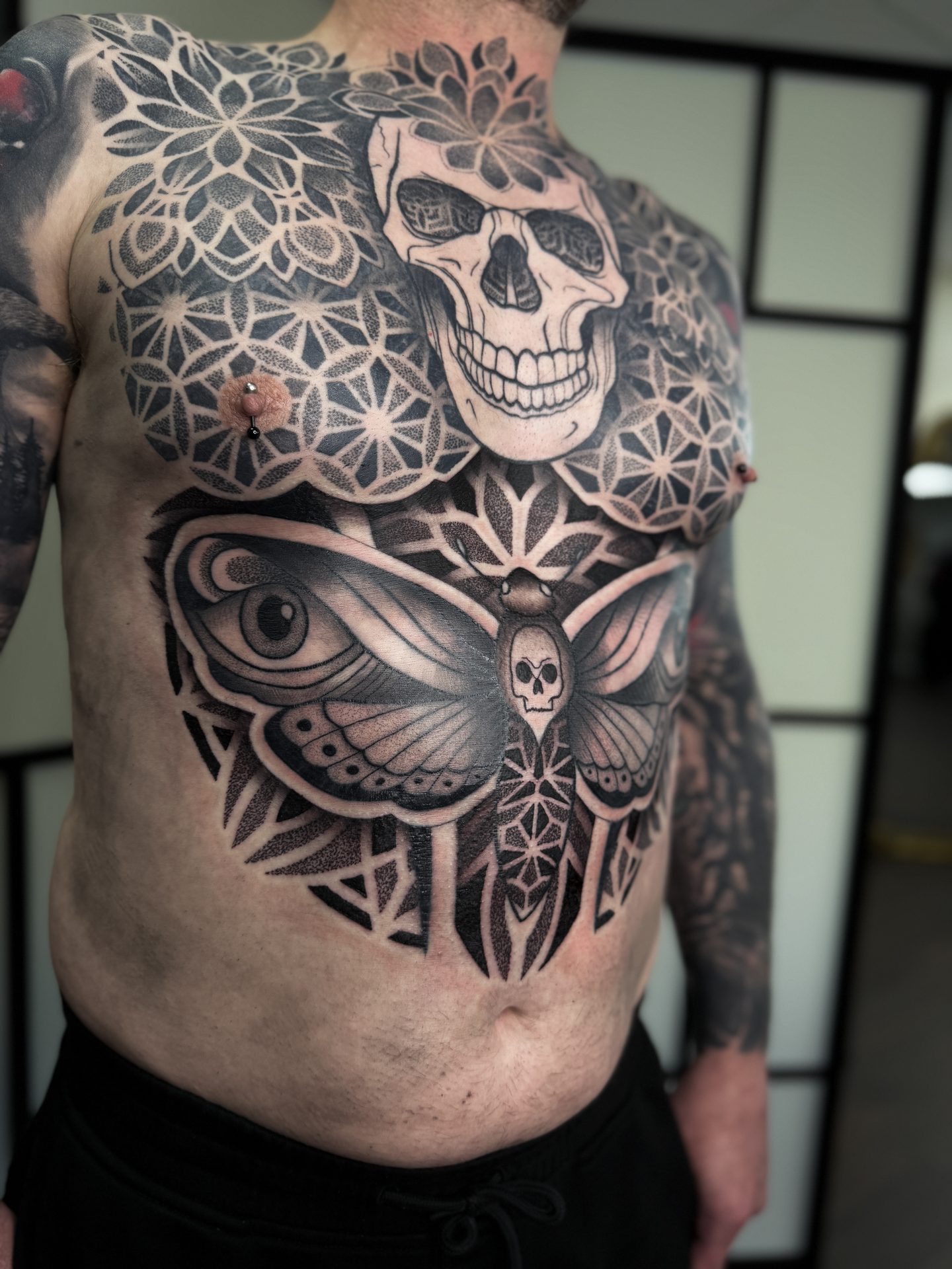 Geometric torso project with skull chest piece by Liam Couper, Fife