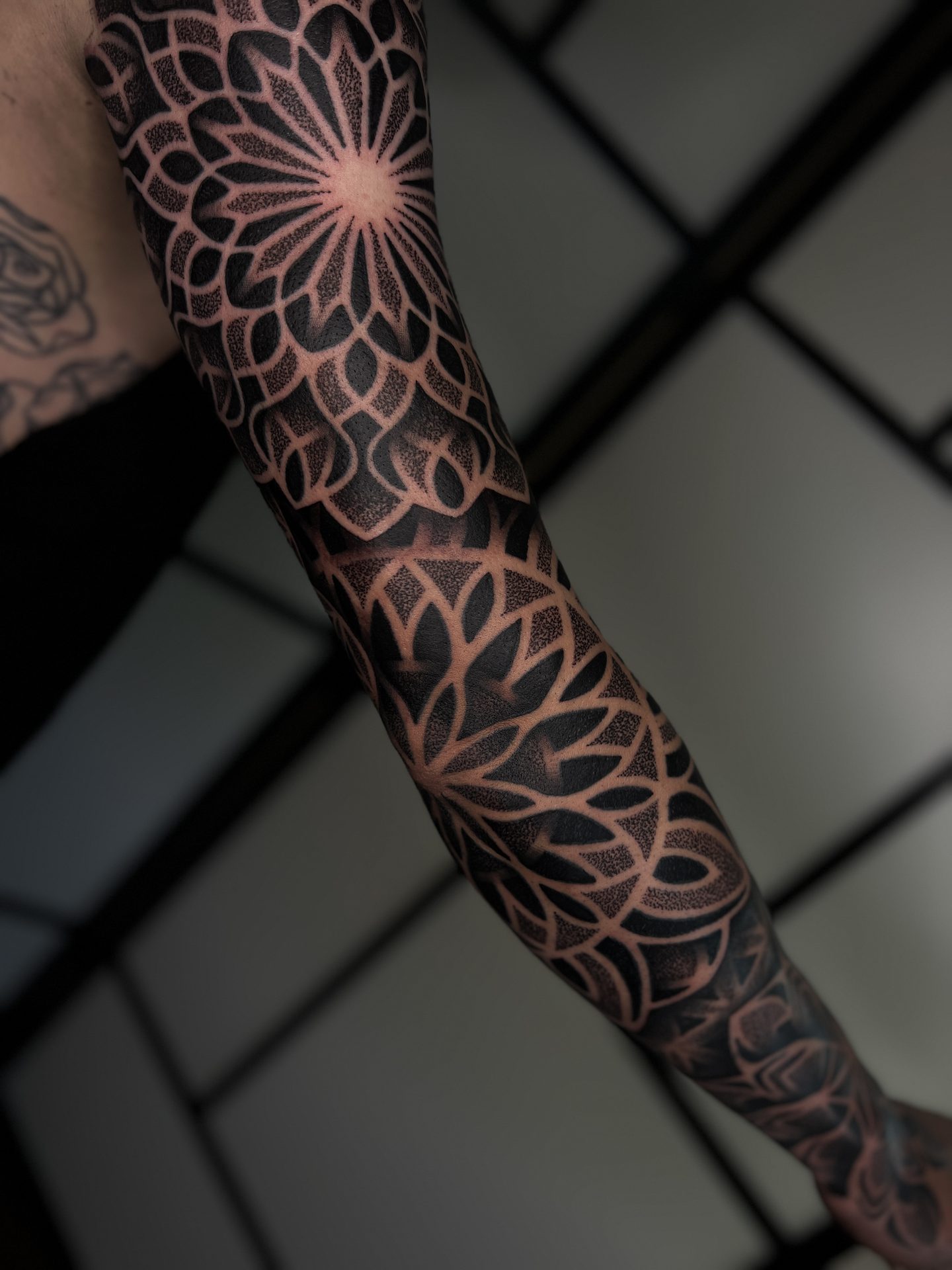 Geometric dotwork sleeve tattoo by Liam Couper, Fife