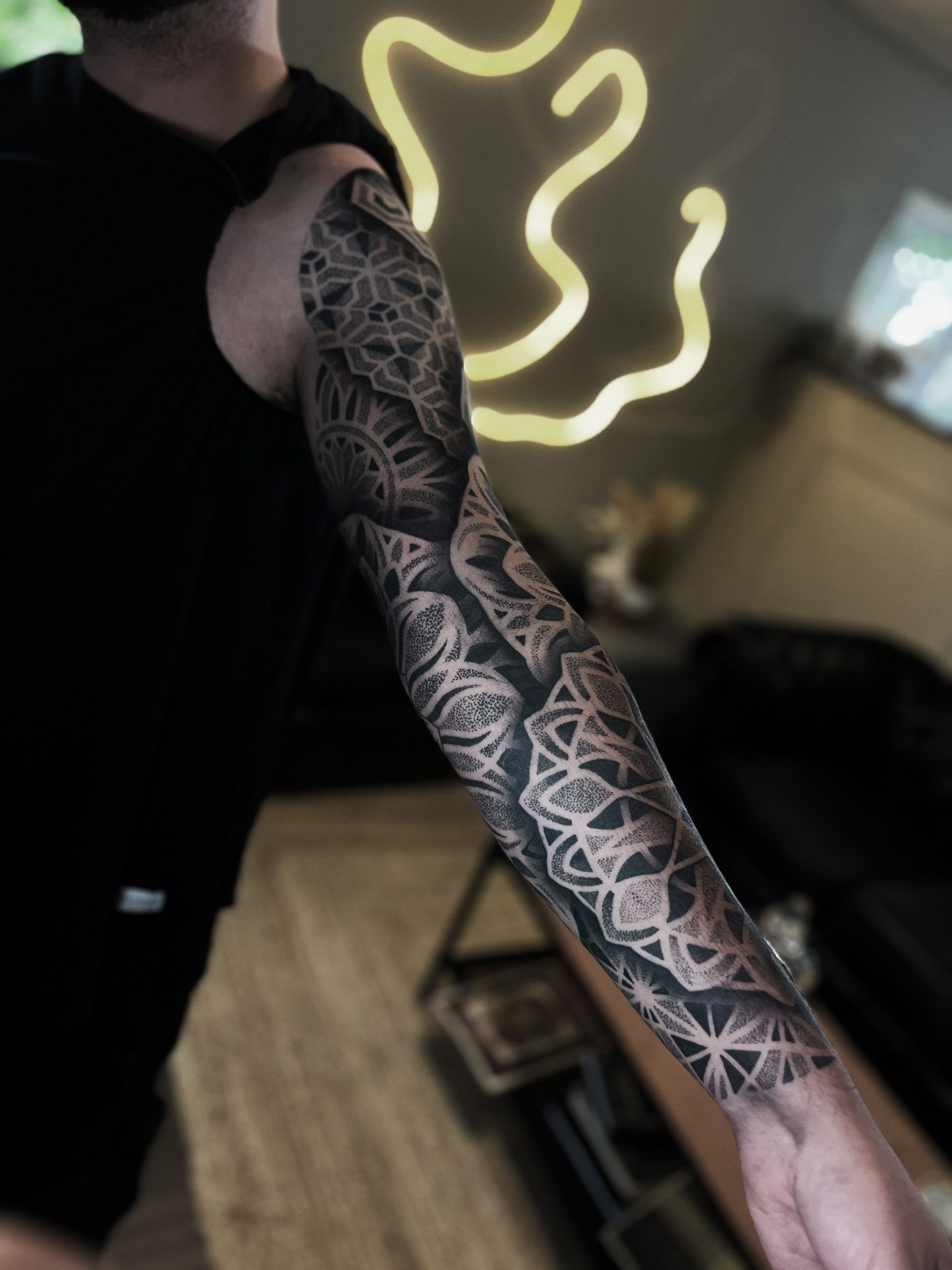 Geometric sleeve tattoo photographed in the coupstattoo studio