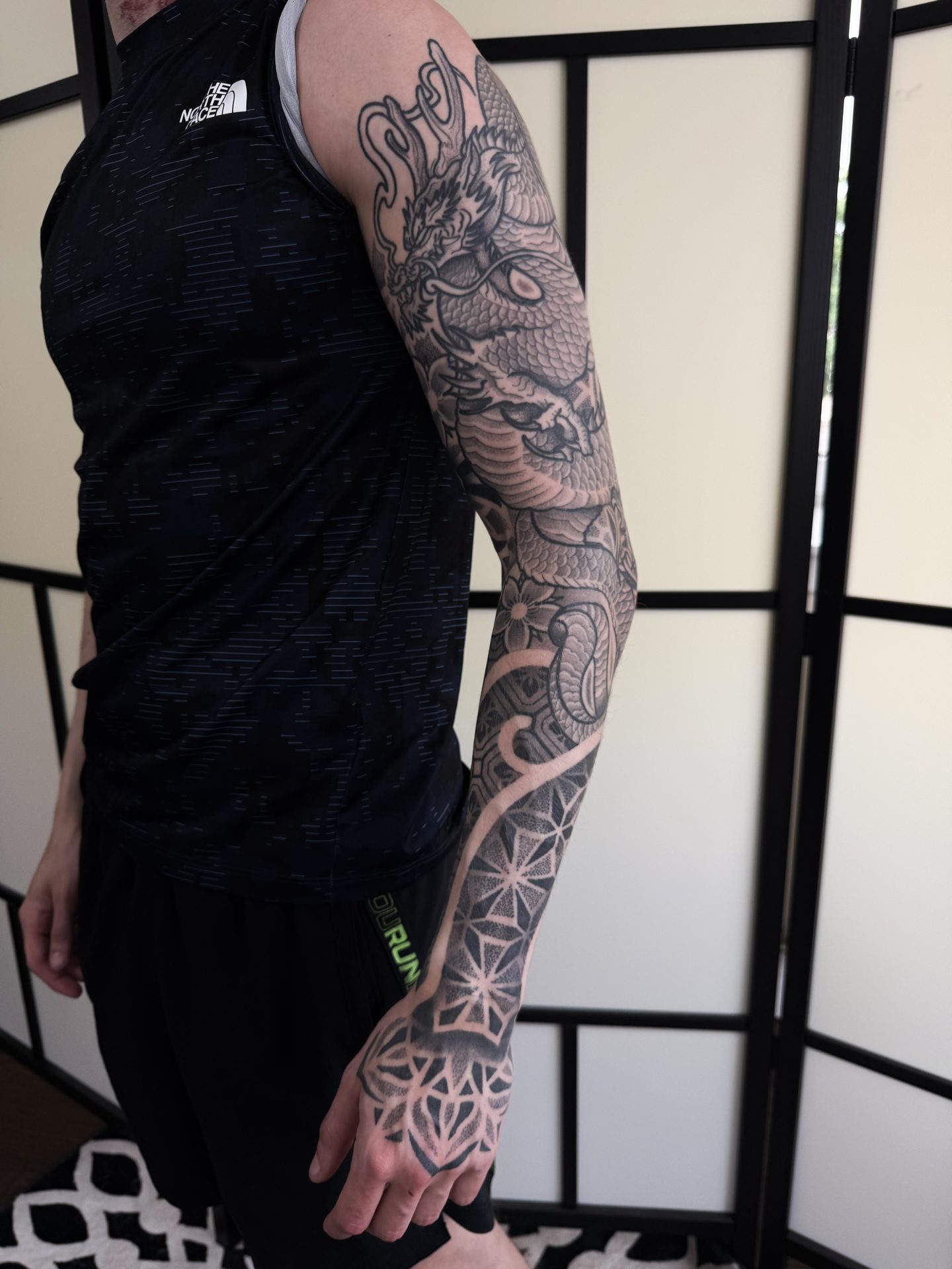 Geometric sleeve tattoo, healed, by Liam Couper
