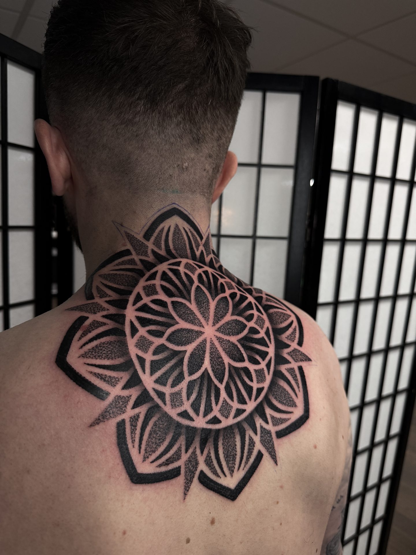 Mandala back of neck tattoo by Liam Couper, Fife