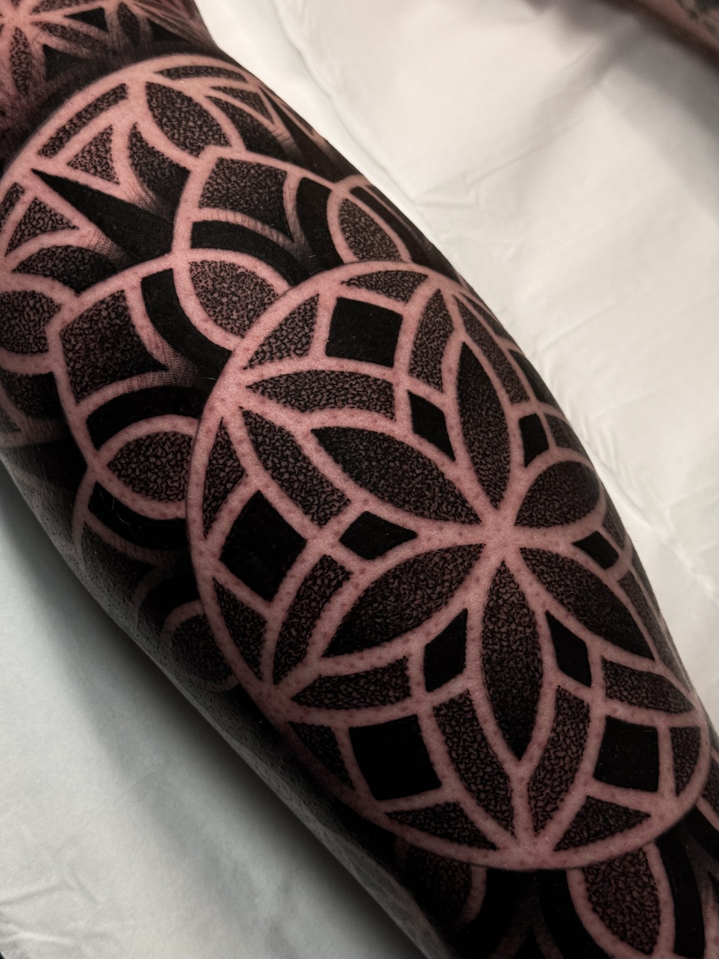 Large mandala calf tattoo by Liam Couper