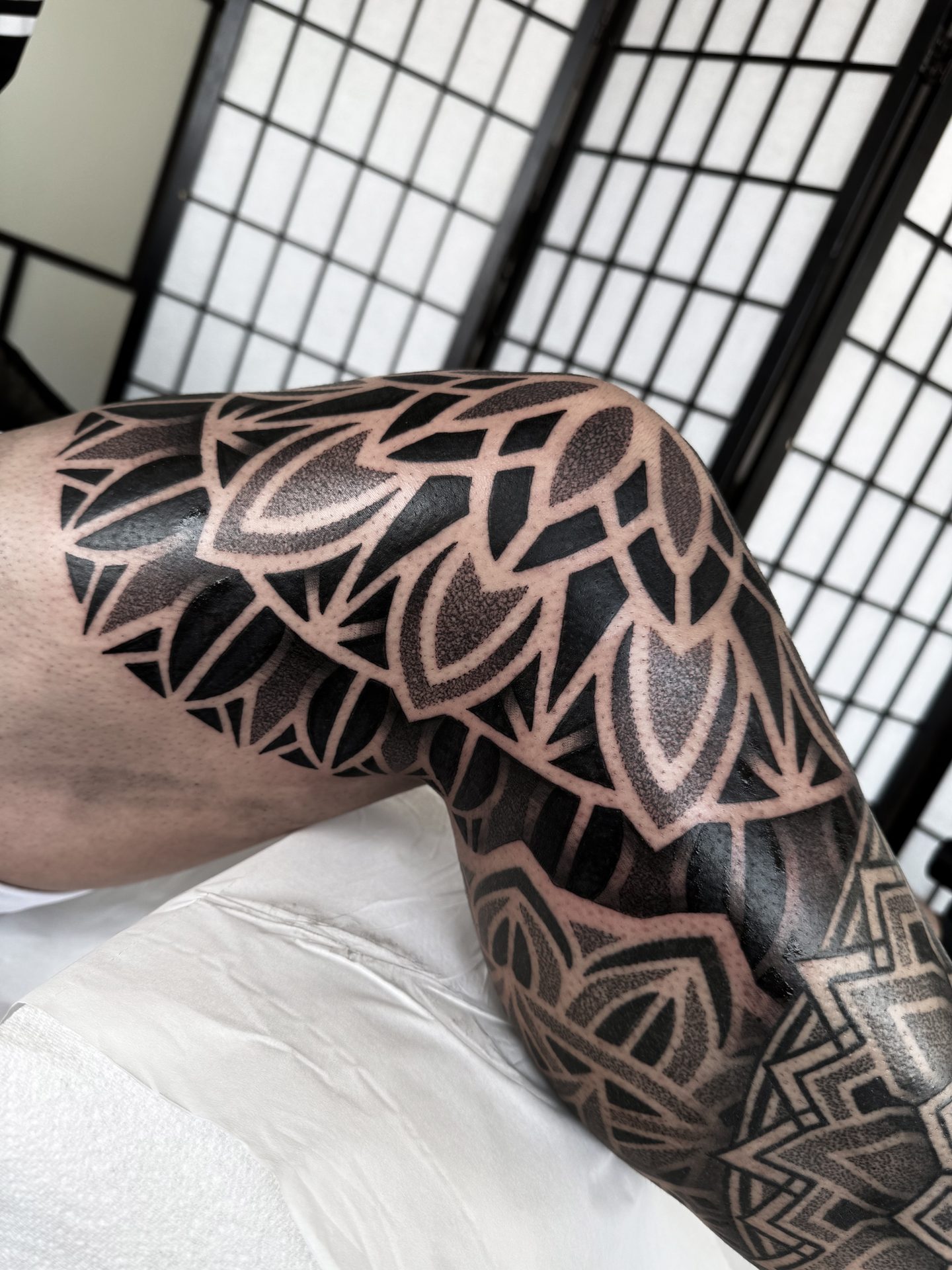 Mandala knee and leg sleeve tattoo by Liam Couper