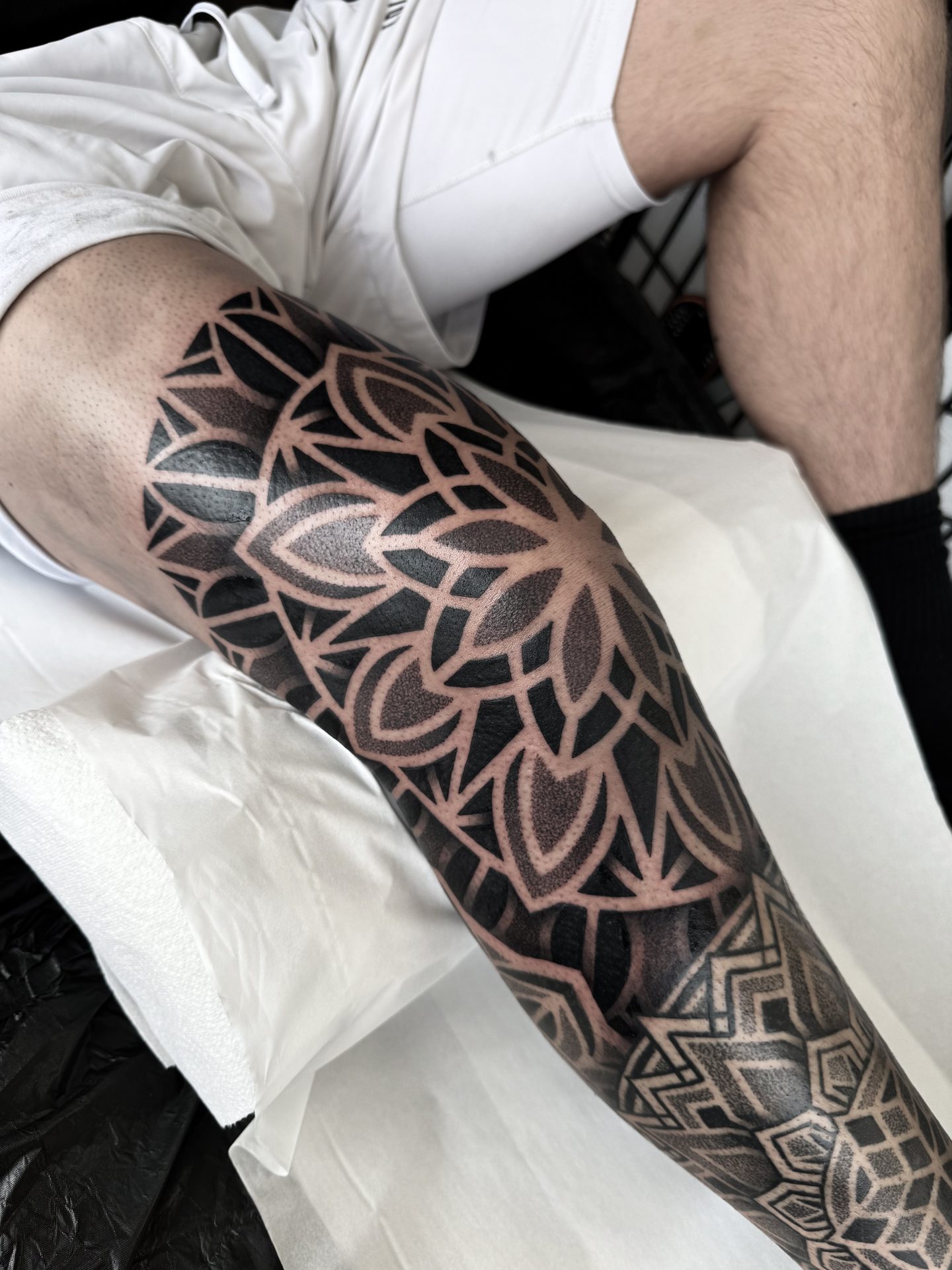 Mandala leg sleeve tattoo by Liam Couper