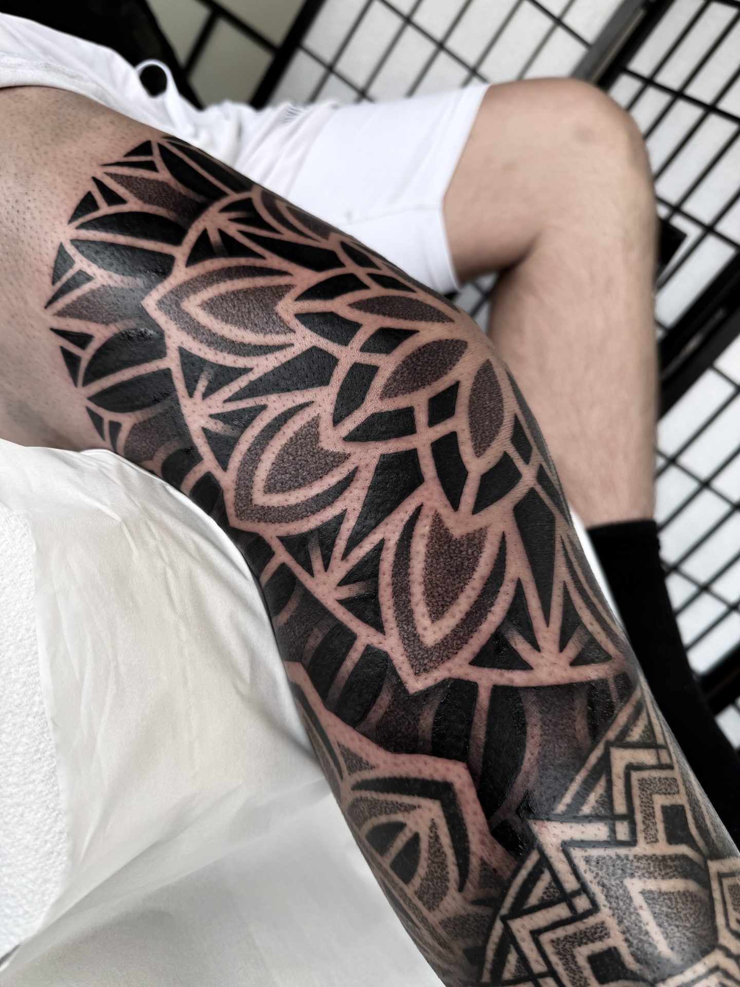 Mandala and geometric leg tattoo by Liam Couper, Fife