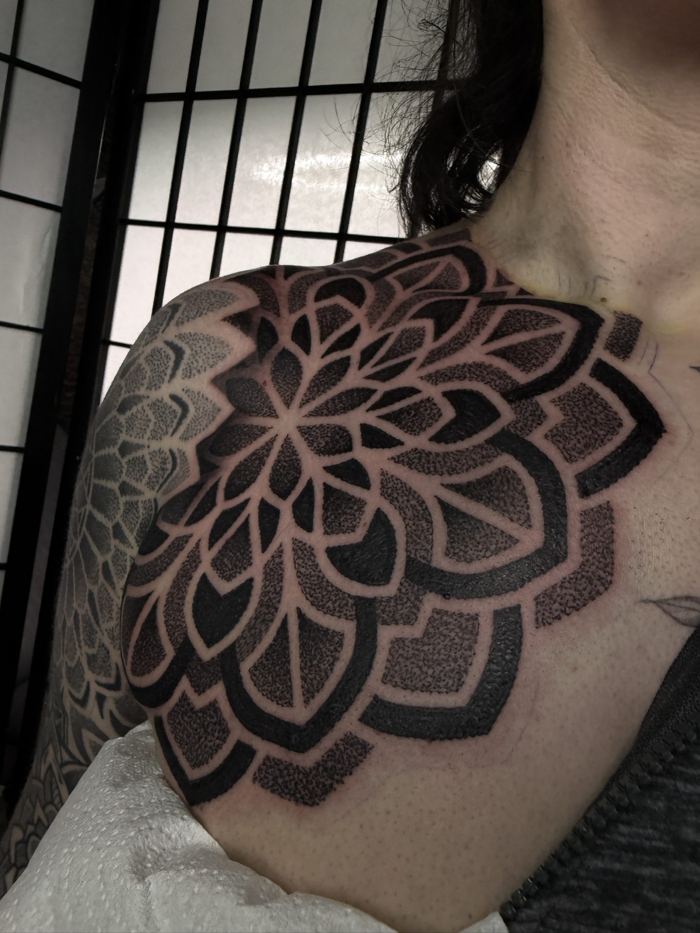 Mandala shoulder and chest tattoo by Liam Couper, Fife