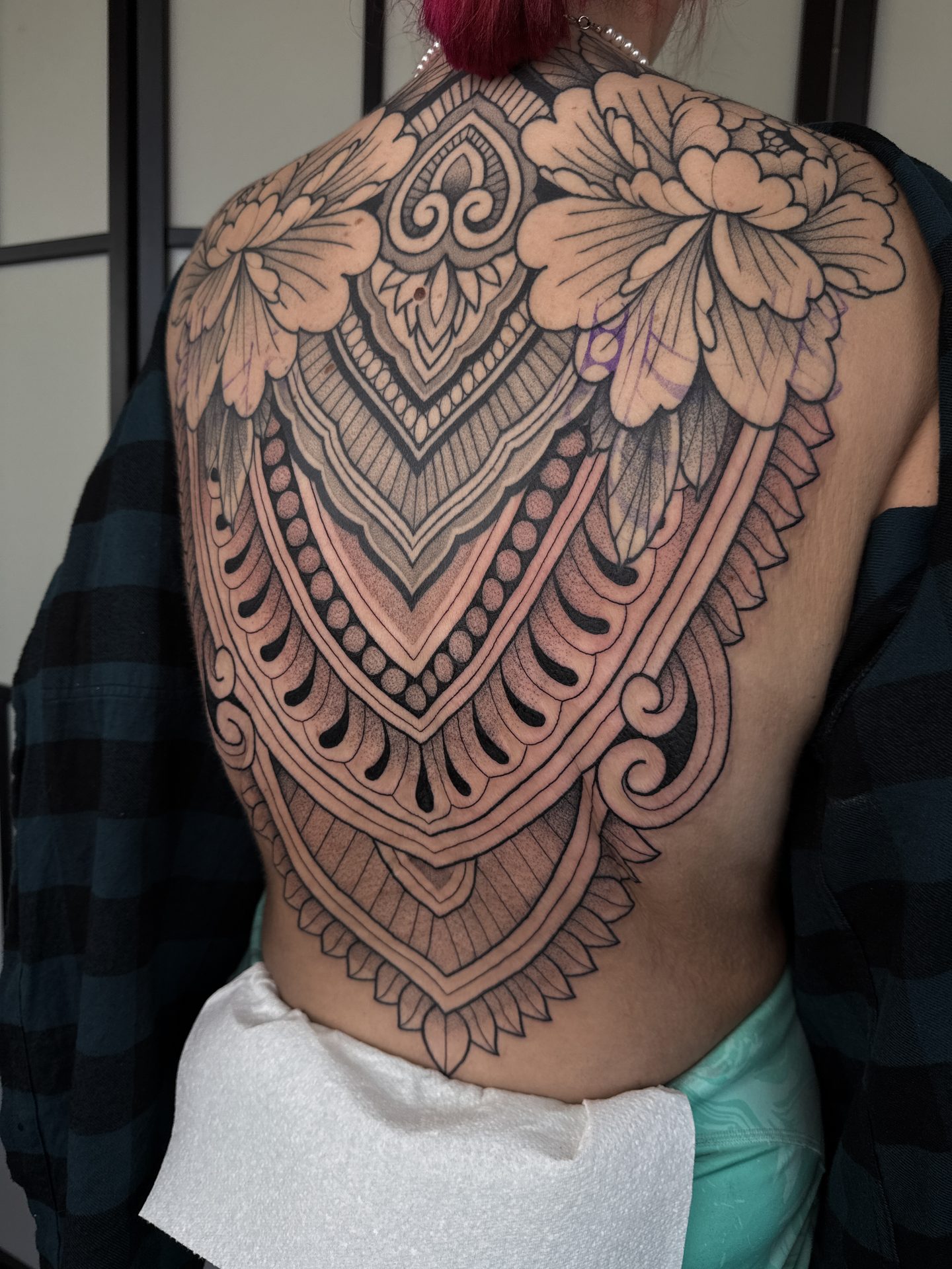 Ornamental back piece with floral shoulders by Liam Couper