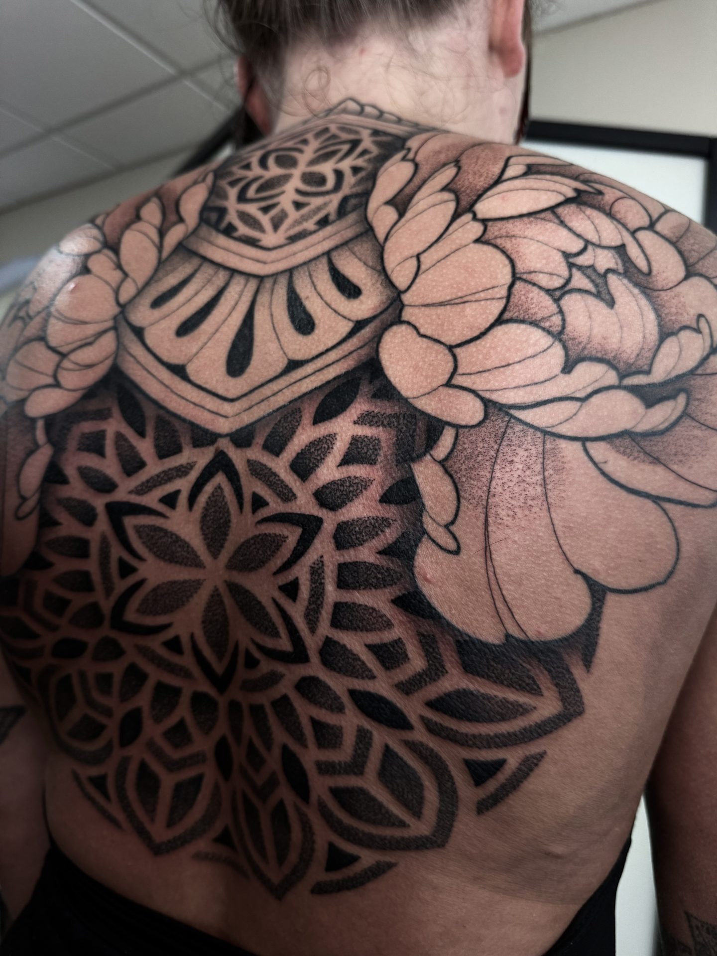 Large scale ornamental back piece by Liam Couper, Fife