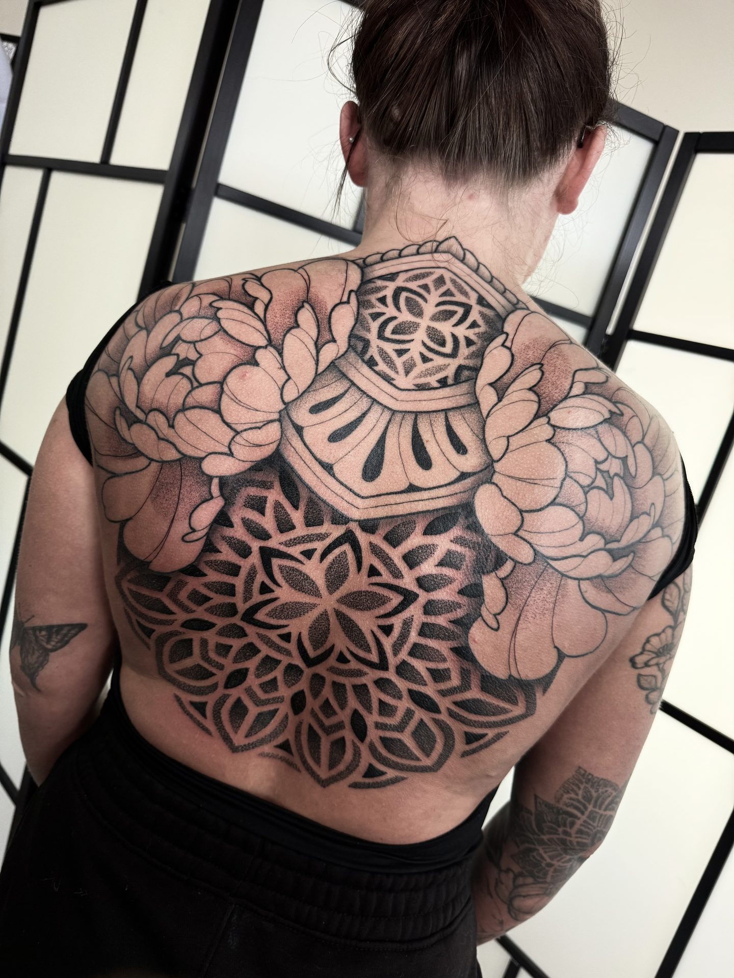 Ornamental back piece with mandala centre by Liam Couper