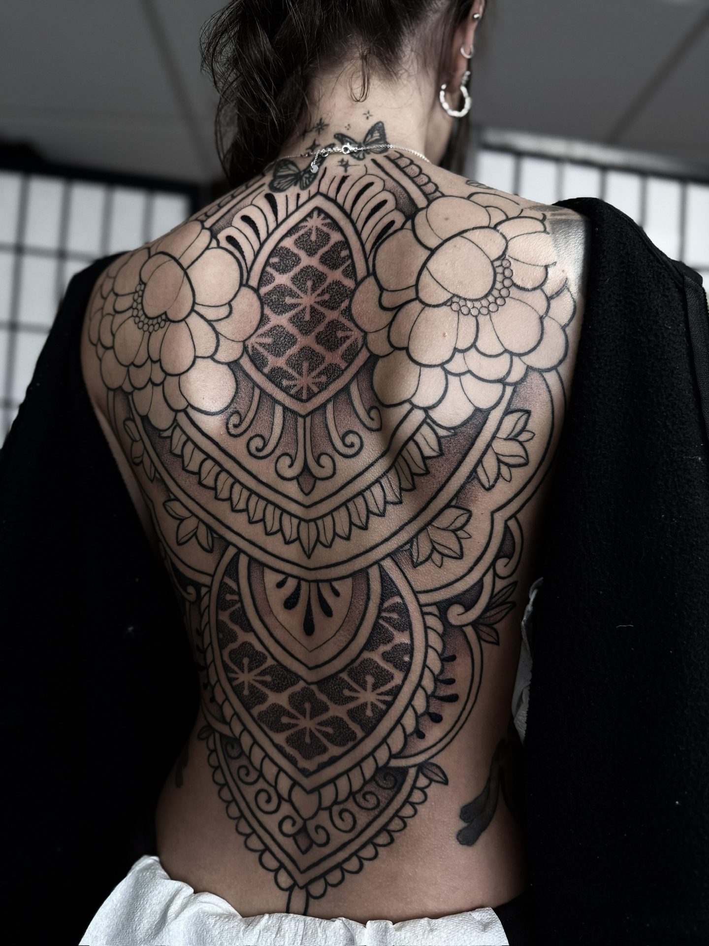 Full ornamental back piece tattoo by Liam Couper