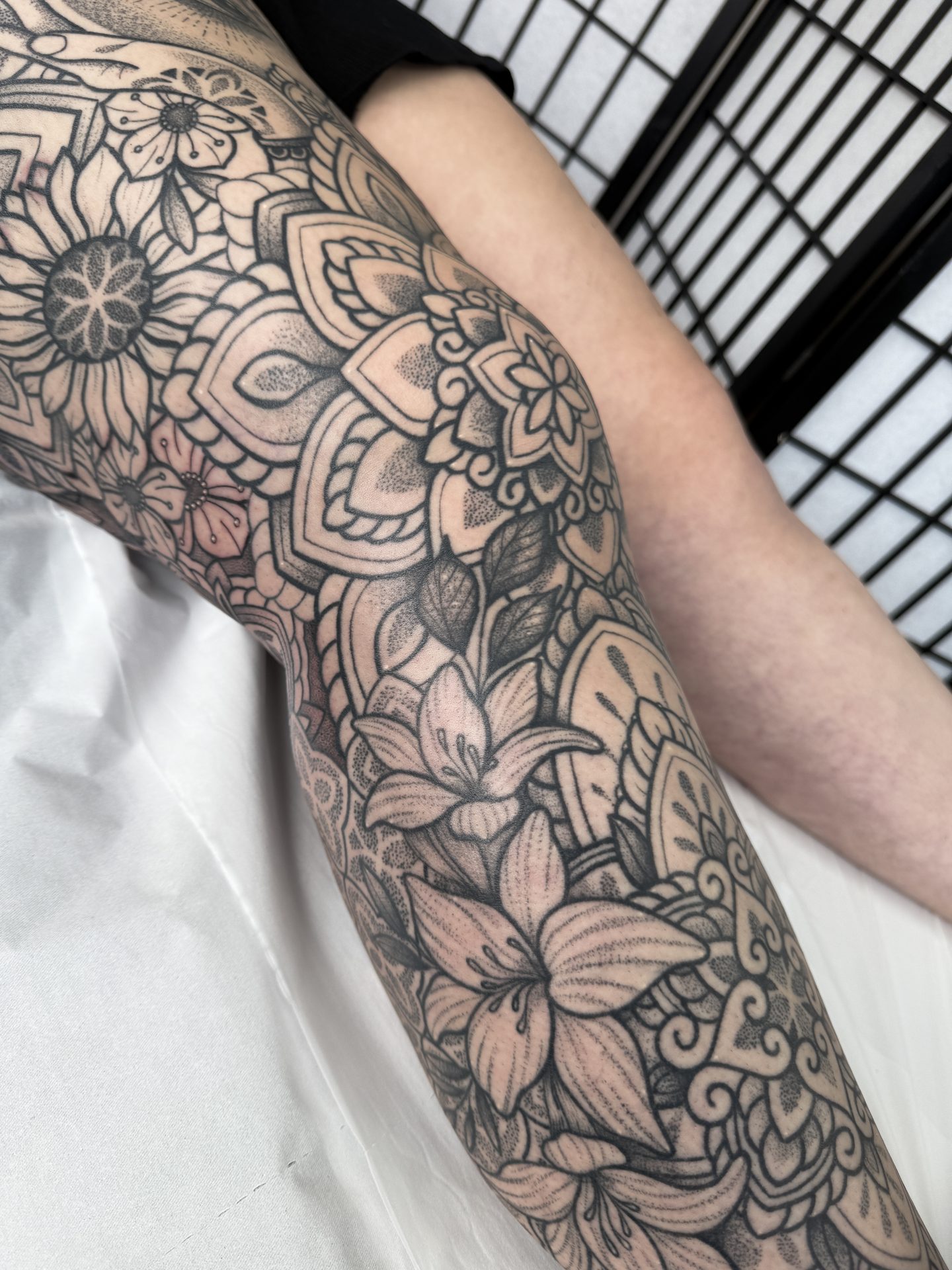 Ornamental leg sleeve with floral detail by Liam Couper