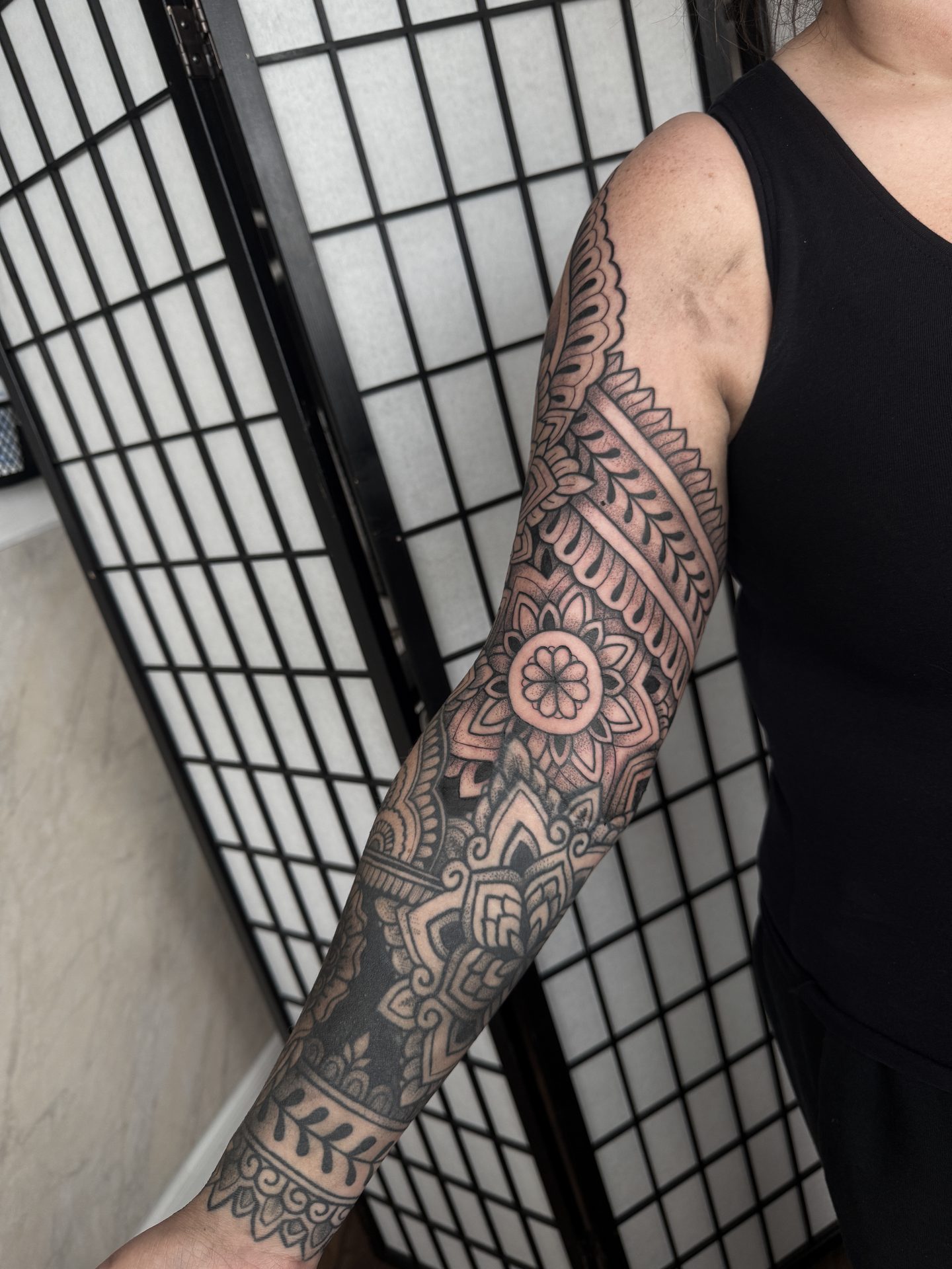 Ornamental full sleeve tattoo, side view, by Liam Couper