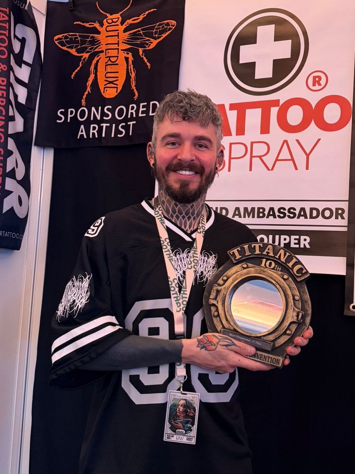 Liam Couper with his award at a UK tattoo convention